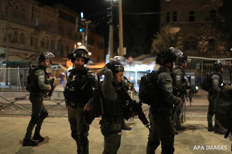 Israeli forces take measures as Palestinian fans gather at the Damascus Gate of the Old City (Bab al-Amud) to show their support for Morocco during the FIFA World Cup Qatar 2022 semi-final match between France and Morocc...