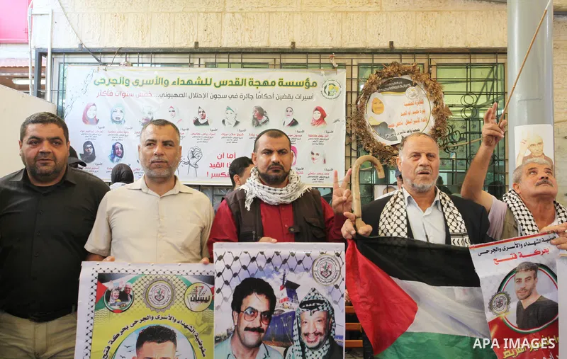Palestinians take part in a protest in support prisoners in Israeli jails, in front of Red Cross office in Gaza city on November 7, 2022. The Palestinian Prisoners Society said Israeli detained more than 6000 Palestinian...