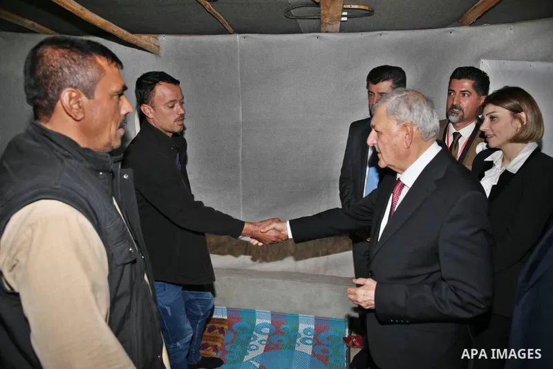 Iraqi President Abdul Latif Jamal Rashid inspects the Sharya camp for the displaced in Dohuk Governorate, IN Iraq 16, 2022. Photo by Iraqi Presidency Office