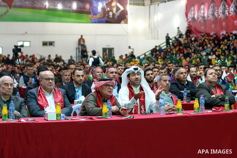 Qatari Ambassador to Palestine, Mohammed al-Emadi attend the FIFA World Cup 2022 match between Qatar and Senegal alongside with Palestinian fans, in Gaza city on November 25, 2022. Senegal record Africa’s first win at th...