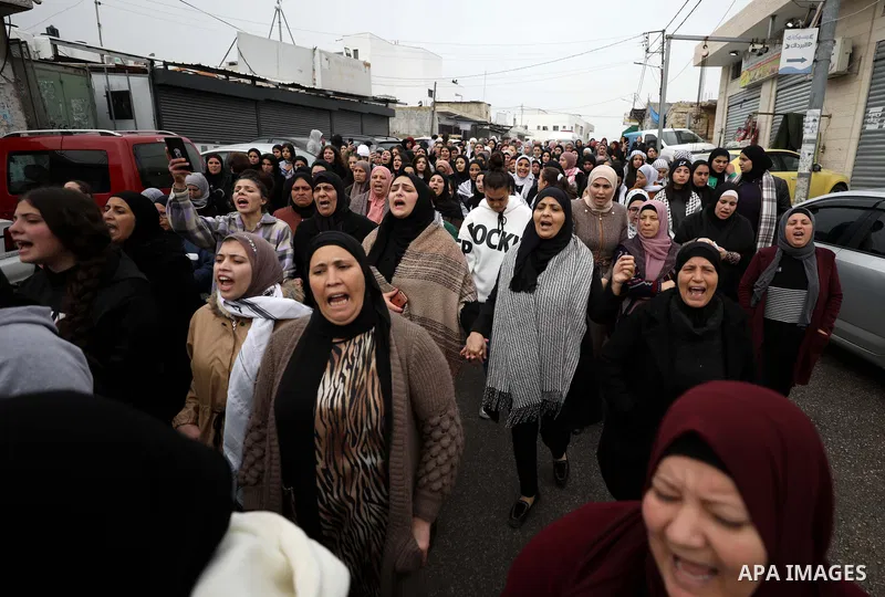 Mourners attend the funeral of Palestinians killed during clashes with Israeli army forces, in the city of Ramallah in the West Bank on November 29, 2022. Three Palestinians were killed by Israeli troops in the West Bank...