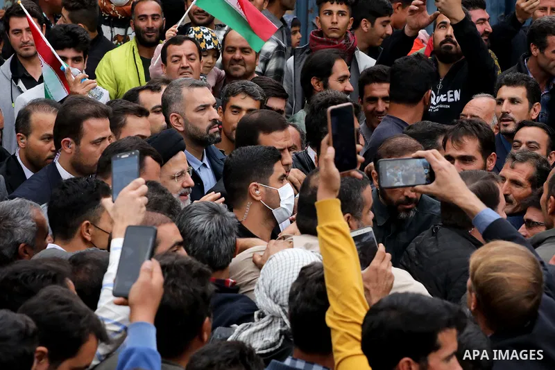 Iranian President Ebrahim Raisi greets people in the street of Qarebouteh village in Zanjan, on October 27, 2022. Photo by Iranian Presidency Office/APAimages