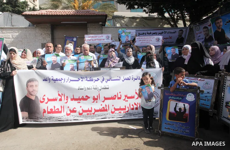 Palestinians take part in solidarity with the cancer-sick prisoner Nasser Abu Hamid, in front of Red Cross office, in Gaza city on October 01, 2022. Israel has escalated its administrative detention policy against Palest...