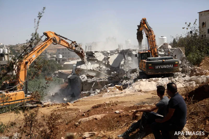 Israeli forces demolish structures in Masafer Yatta to the south of the West Bank city of Hebron on October 3, 2022. The Israeli forces today demolished a Palestinian-owned house and two storage places in Masafer Yatta,...