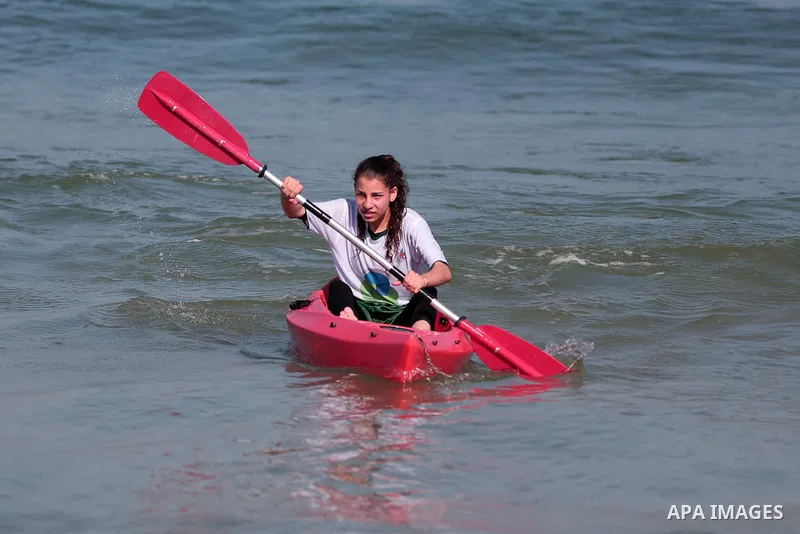 Palestinian players take part in the sailing and rowing championship on the shore of the Mediterranean, in Gaza city, on September 11, 2022. The Palestinian Sailing and Rowing Federation organized the sailing and rowing...