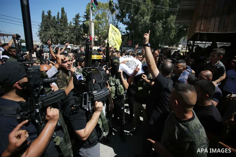 Palestinians carry the body of Hamad Abu Jelda, 24, died last night of wounds sustained by Israeli gunfire during an Israeli military raid during his funeral in the the West Bank city of Jenin on September 11, 2022. Hama...