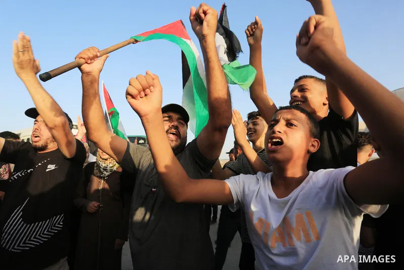 Palestinians gather during a demonstration next to the border fence with Israel, east of Gaza City in solidarity with al-Aqsa mosque on September 26, 2022. Hamas threatened "repercussions" over Jewish visits to Jerusalem...