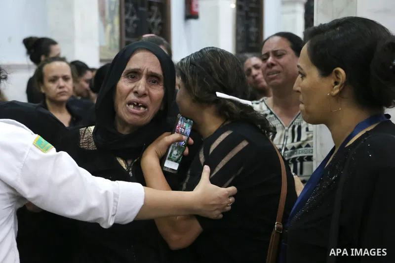 Egyptians react during the funeral of victims, who died due to the fire that broke out at the Abu Sifin church, inside the Church of the Blessed Virgin Mary at Warraq Al Arab district in Giza Governorate, Egypt, August 1...