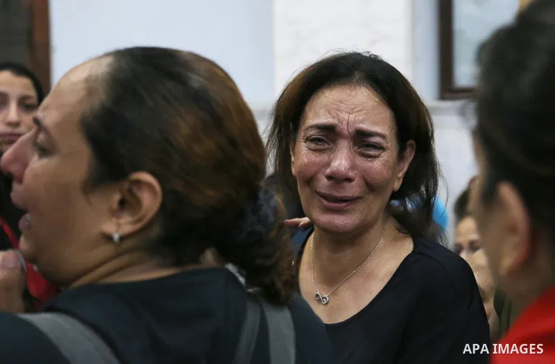 Egyptians react during the funeral of victims, who died due to the fire that broke out at the Abu Sifin church, inside the Church of the Blessed Virgin Mary at Warraq Al Arab district in Giza Governorate, Egypt, August 1...