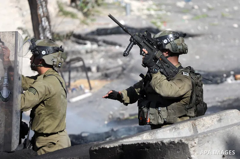 Clashes between Palestinian protesters and Israeli forces following a demonstration against settlement, in the West Bank city of Hebron on August 19, 2022. Photo by Mamoun Wazwaz