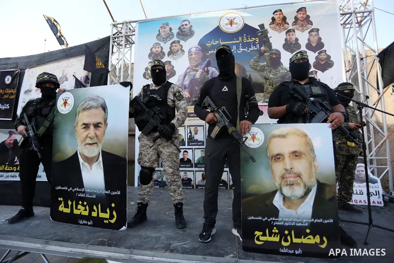 Militants of Al-Quds Brigades, the military wing of Palestinian Islamic Jihad movement take part in memorial service of Palestinians who were killed by Israeli forces in the West Bank and the latest Israel-Gaza conflict,...