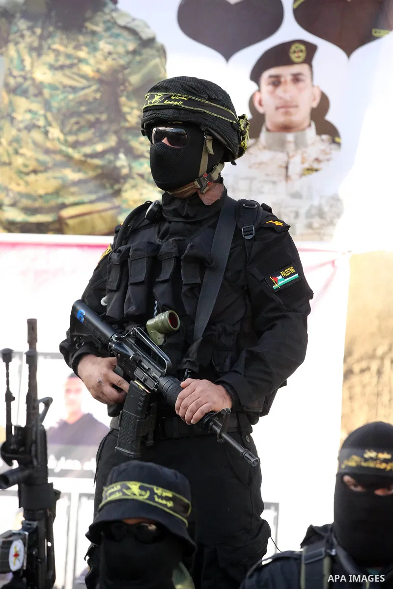 Militants of Al-Quds Brigades, the military wing of Palestinian Islamic Jihad movement take part in memorial service of Palestinians who were killed by Israeli forces in the West Bank and the latest Israel-Gaza conflict,...