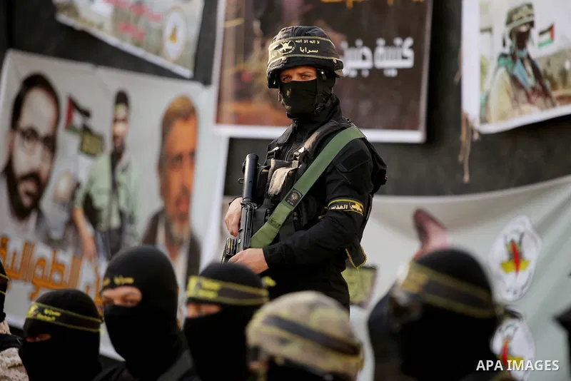 Militants of Al-Quds Brigades, the military wing of Palestinian Islamic Jihad movement take part in memorial service of Palestinians who were killed by Israeli forces in the West Bank and the latest Israel-Gaza conflict,...
