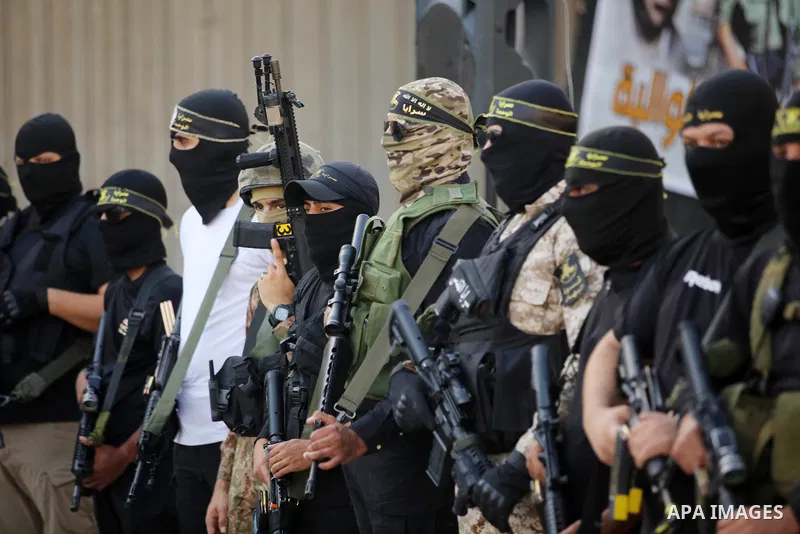 Militants of Al-Quds Brigades, the military wing of Palestinian Islamic Jihad movement take part in memorial service of Palestinians who were killed by Israeli forces in the West Bank and the latest Israel-Gaza conflict,...