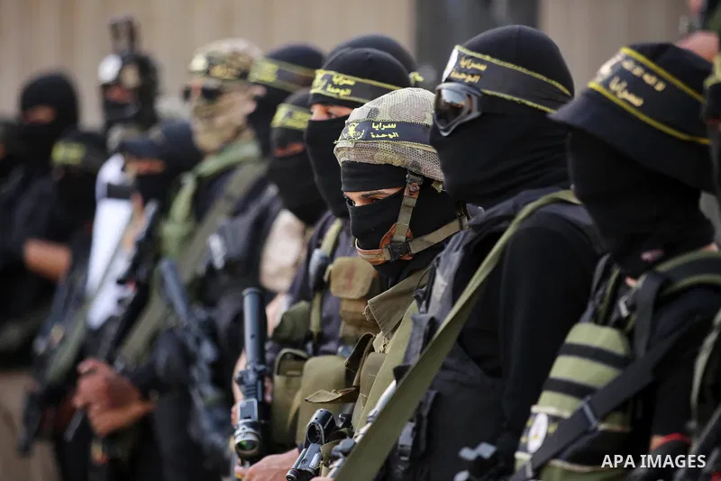 Militants of Al-Quds Brigades, the military wing of Palestinian Islamic Jihad movement take part in memorial service of Palestinians who were killed by Israeli forces in the West Bank and the latest Israel-Gaza conflict,...