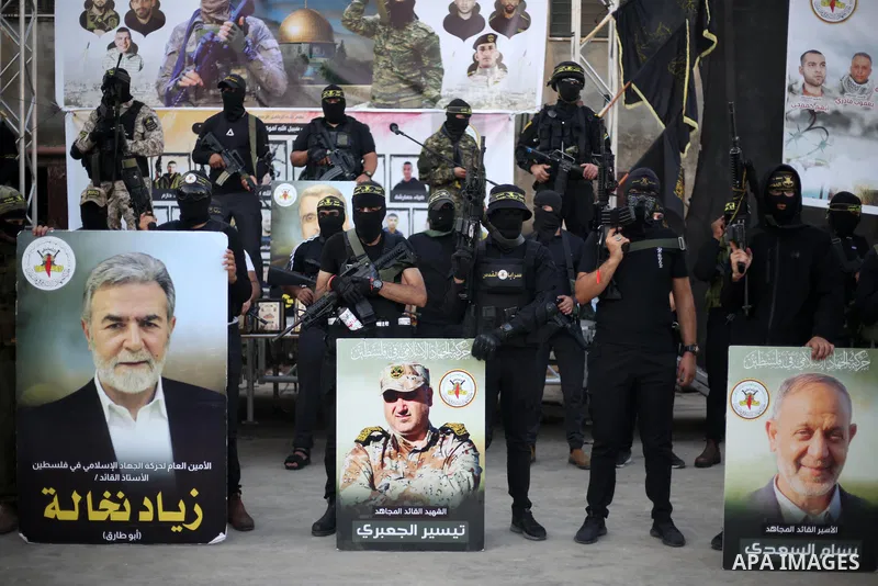 Militants of Al-Quds Brigades, the military wing of Palestinian Islamic Jihad movement take part in memorial service of Palestinians who were killed by Israeli forces in the West Bank and the latest Israel-Gaza conflict,...