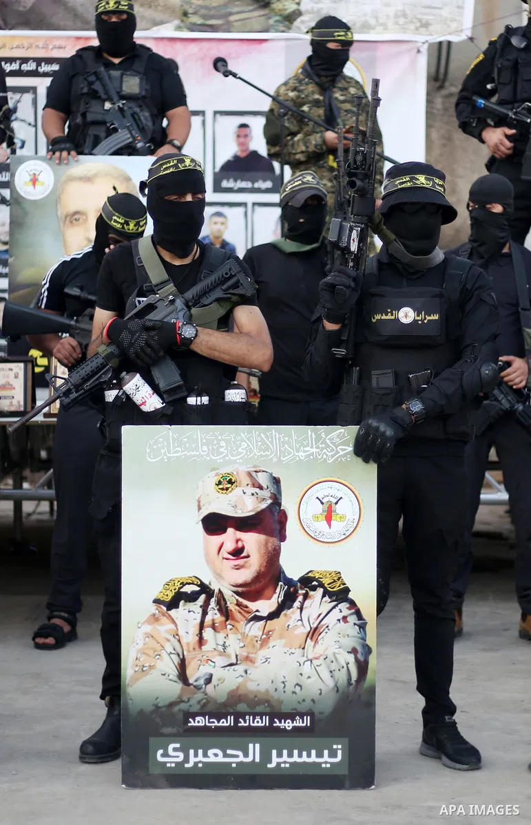Militants of Al-Quds Brigades, the military wing of Palestinian Islamic Jihad movement take part in memorial service of Palestinians who were killed by Israeli forces in the West Bank and the latest Israel-Gaza conflict,...