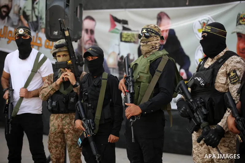 Militants of Al-Quds Brigades, the military wing of Palestinian Islamic Jihad movement take part in memorial service of Palestinians who were killed by Israeli forces in the West Bank and the latest Israel-Gaza conflict,...