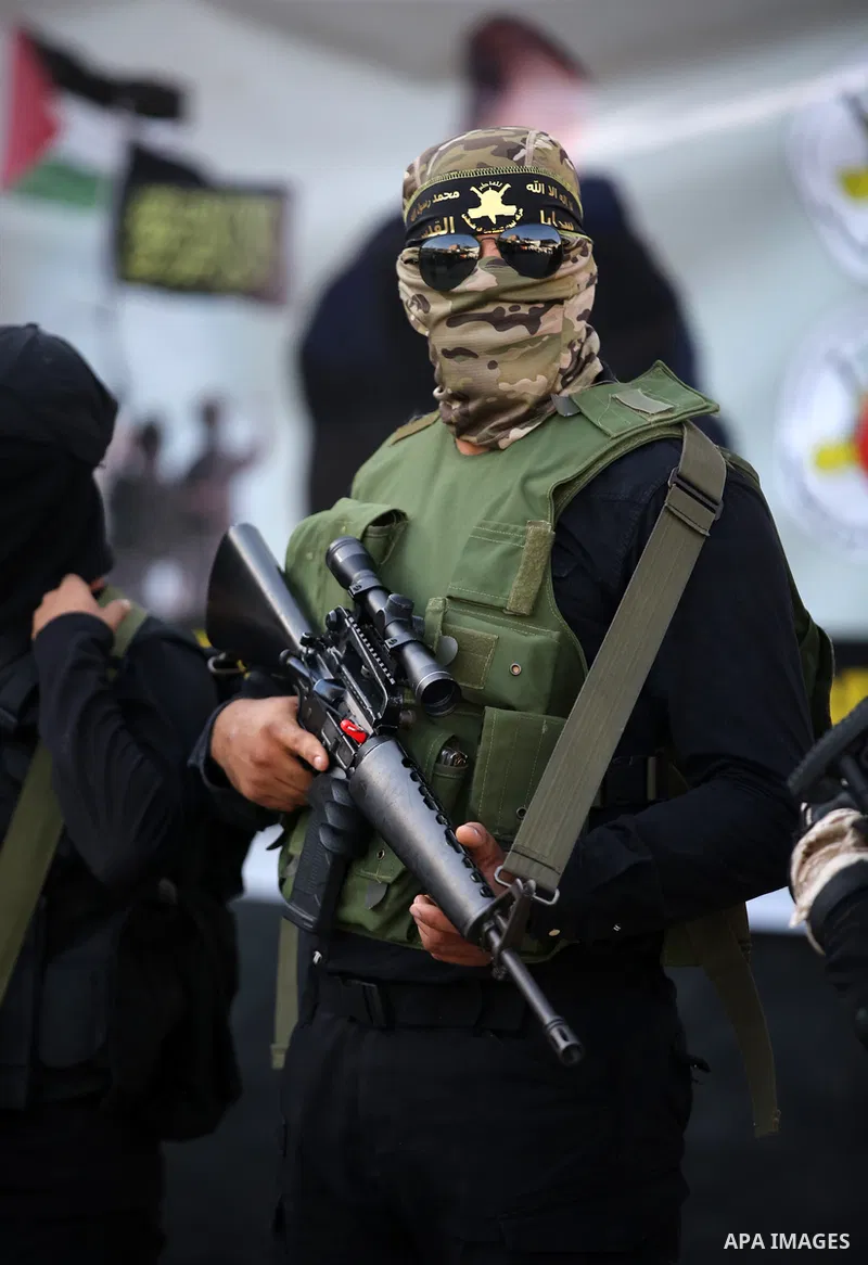 Militants of Al-Quds Brigades, the military wing of Palestinian Islamic Jihad movement take part in memorial service of Palestinians who were killed by Israeli forces in the West Bank and the latest Israel-Gaza conflict,...