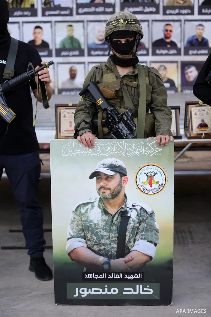 Militants of Al-Quds Brigades, the military wing of Palestinian Islamic Jihad movement take part in memorial service of Palestinians who were killed by Israeli forces in the West Bank and the latest Israel-Gaza conflict,...