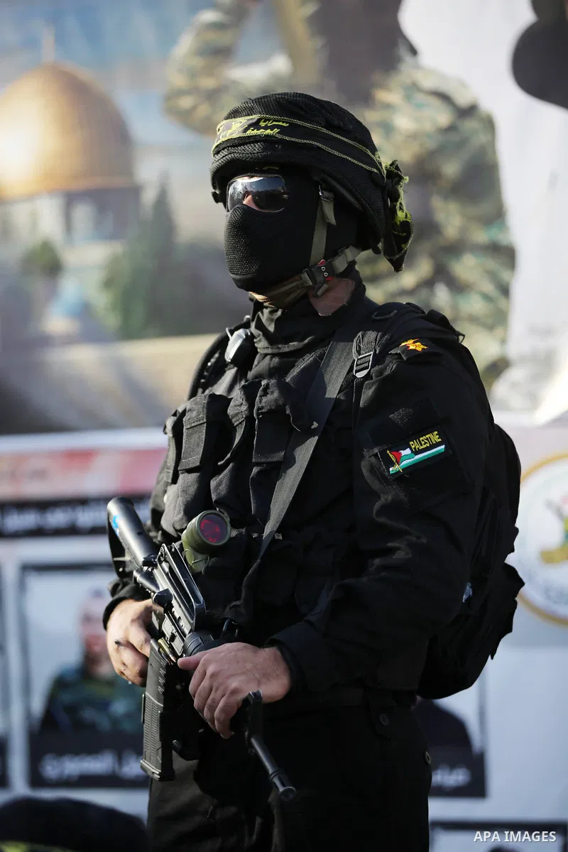 Militants of Al-Quds Brigades, the military wing of Palestinian Islamic Jihad movement take part in memorial service of Palestinians who were killed by Israeli forces in the West Bank and the latest Israel-Gaza conflict,...