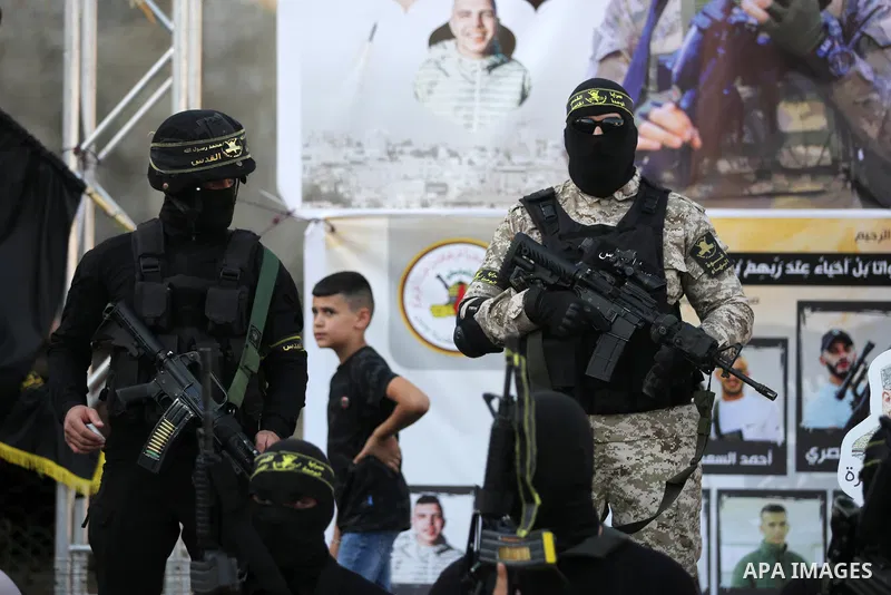 Militants of Al-Quds Brigades, the military wing of Palestinian Islamic Jihad movement take part in memorial service of Palestinians who were killed by Israeli forces in the West Bank and the latest Israel-Gaza conflict,...
