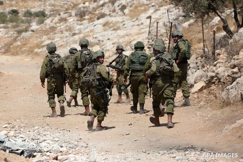 Israeli forces take position during clashes with Palestinian protesters following a demonstration against settlements in the village of Beit Dajan in the West Bank, on August 26, 2022. Photo by Shadi Jarar'ah\ apaimages