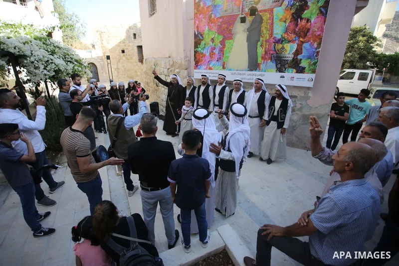 Palestinians wearing traditional dress during participation in the bride Exhibition in the northern town of Asira, north the West Bank city of Nablus on August 27, 2022. Photo by Shadi Jarar'ah\ apaimages