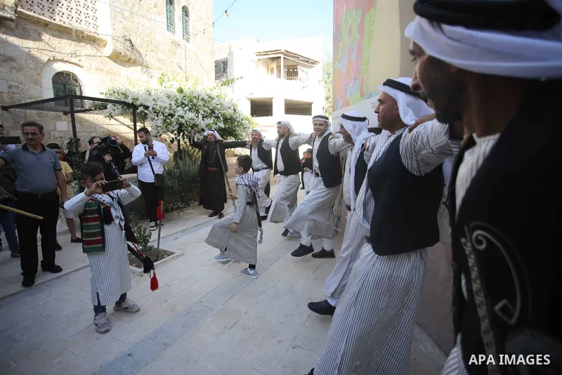 Palestinians wearing traditional dress during participation in the bride Exhibition in the northern town of Asira, north the West Bank city of Nablus on August 27, 2022. Photo by Shadi Jarar'ah\ apaimages