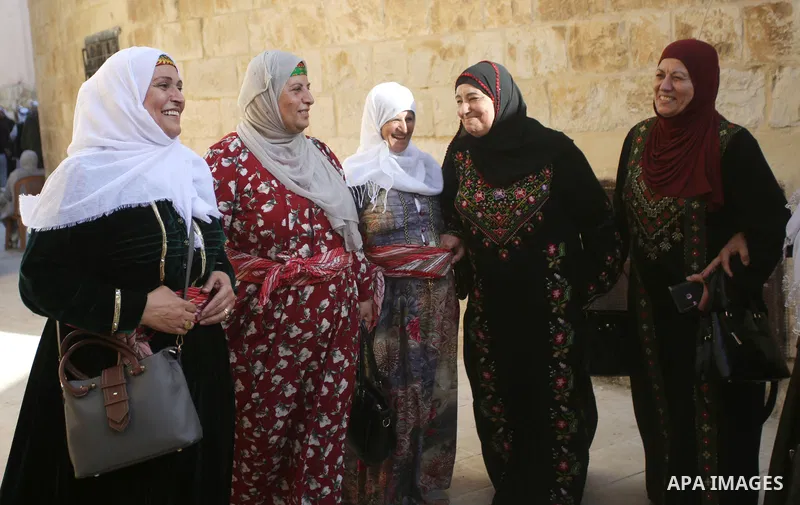 Palestinians wearing traditional dress during participation in the bride Exhibition in the northern town of Asira, north the West Bank city of Nablus on August 27, 2022. Photo by Shadi Jarar'ah\ apaimages