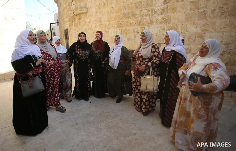 Palestinians wearing traditional dress during participation in the bride Exhibition in the northern town of Asira, north the West Bank city of Nablus on August 27, 2022. Photo by Shadi Jarar'ah\ apaimages