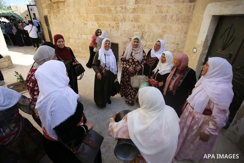 Palestinians wearing traditional dress during participation in the bride Exhibition in the northern town of Asira, north the West Bank city of Nablus on August 27, 2022. Photo by Shadi Jarar'ah\ apaimages