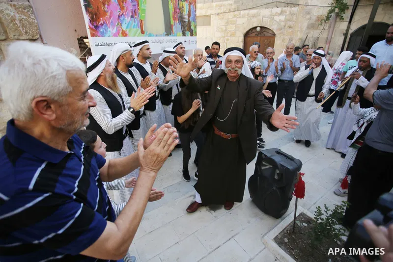 Palestinians wearing traditional dress during participation in the bride Exhibition in the northern town of Asira, north the West Bank city of Nablus on August 27, 2022. Photo by Shadi Jarar'ah\ apaimages