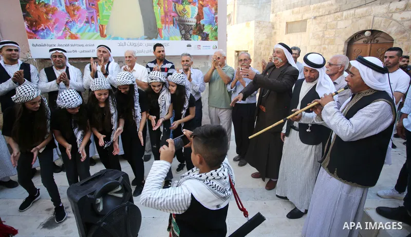 Palestinians wearing traditional dress during participation in the bride Exhibition in the northern town of Asira, north the West Bank city of Nablus on August 27, 2022. Photo by Shadi Jarar'ah\ apaimages