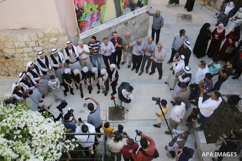 Palestinians wearing traditional dress during participation in the bride Exhibition in the northern town of Asira, north the West Bank city of Nablus on August 27, 2022. Photo by Shadi Jarar'ah\ apaimages