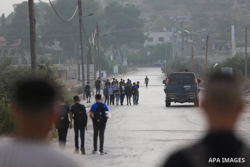 Palestinian students walk to their schools of the first day of the new year study, in al-Lubban al-Sharqiya village, south of Nablus city, in the West Bank on August 29, 2022. Attacks on education by Israeli military for...