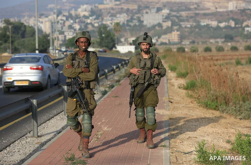 Palestinian students walk to their schools of the first day of the new year study, in al-Lubban al-Sharqiya village, south of Nablus city, in the West Bank on August 29, 2022. Attacks on education by Israeli military for...