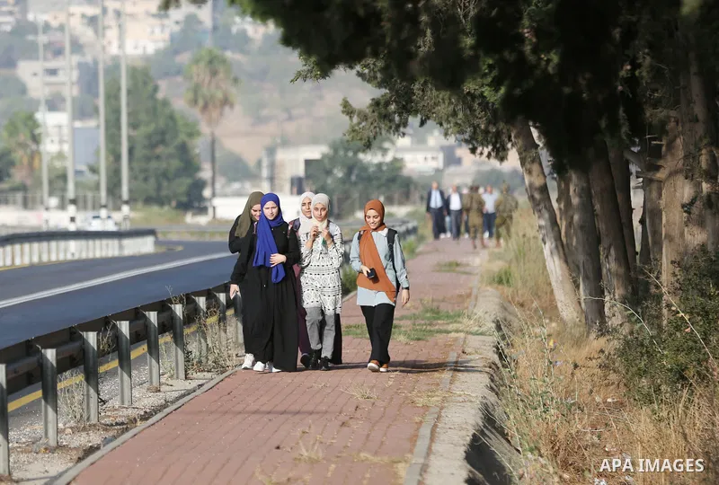 Palestinian students walk to their schools of the first day of the new year study, in al-Lubban al-Sharqiya village, south of Nablus city, in the West Bank on August 29, 2022. Attacks on education by Israeli military for...