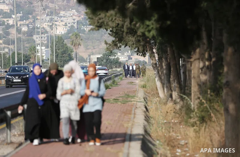 Palestinian students walk to their schools of the first day of the new year study, in al-Lubban al-Sharqiya village, south of Nablus city, in the West Bank on August 29, 2022. Attacks on education by Israeli military for...