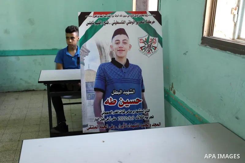 Classmates of Palestinian Hussein Taha, who was killed by Israeli forces on August 9, mourn his death on the first day of school after the summer holiday, in the West Bank city of Nablus. The Palestinian Ministry of Educ...