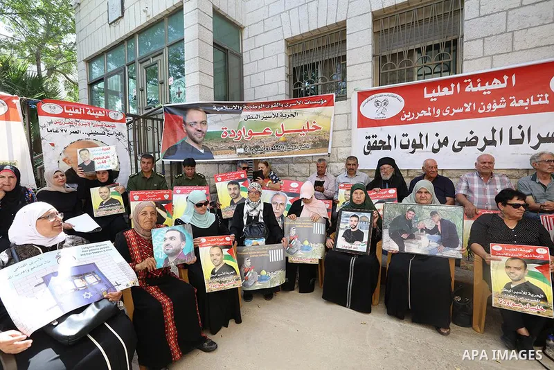 Palestinians take part in a protest in solidarity with prisoners on hunger strike in Israeli jails, in the West Bank city of Ramallah on August 30, 2022. The prisoners’ committee, which represents all the factions, has d...