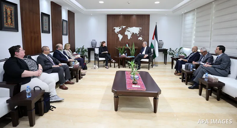 Palestinian Prime Minister Mohammad Shtayyeh meets with New USAID Mission Director in the West Bank and Gaza Amy Tohl-Stoll, in the West Bank city of Ramallah on August 30, 2022. Photo by Shadi Hatem\ apaimages
