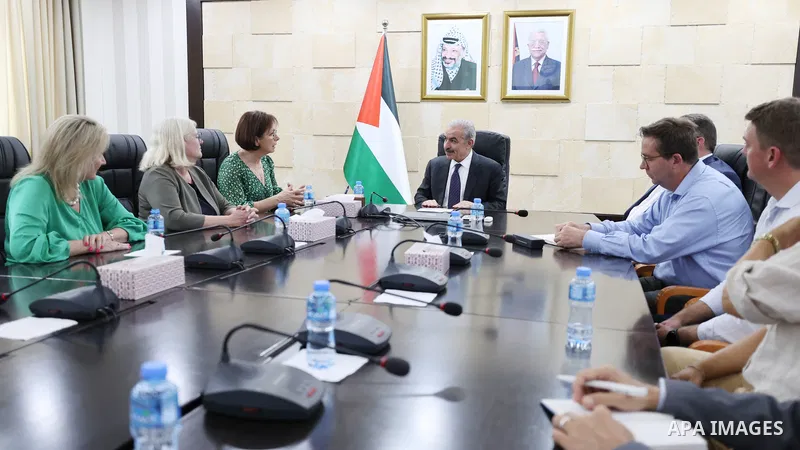 Palestinian Prime Minister Mohammad Shtayyeh meets with a delegation from the Australian Senate and Parliament, in the West Bank city of Ramallah on August 30, 2022. Photo by Shadi Hatem\ apaimages