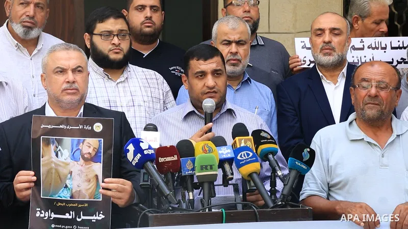 Members of Palestinian factions take part in a press conference in solidarity with prisoners on hunger strike in Israeli jails, in Gaza City on August 31, 2022. More than 4500 Palestinian freedom fighters incarcerated in...