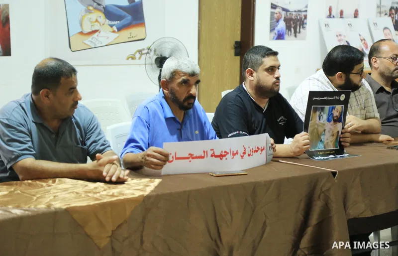 Members of Palestinian factions take part in a meeting in solidarity with prisoners on hunger strike in Israeli jails, in Gaza City on August 31, 2022. More than 4500 Palestinian freedom fighters incarcerated in Israel b...