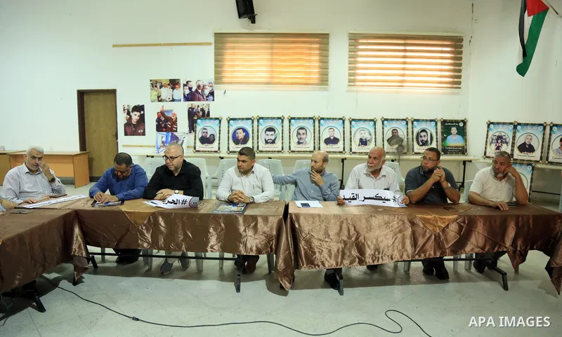 Members of Palestinian factions take part in a meeting in solidarity with prisoners on hunger strike in Israeli jails, in Gaza City on August 31, 2022. More than 4500 Palestinian freedom fighters incarcerated in Israel b...