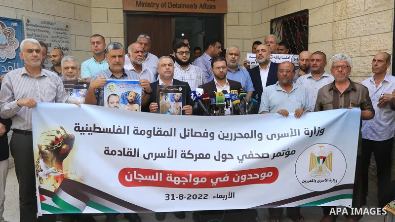 Members of Palestinian factions take part in a press conference in solidarity with prisoners on hunger strike in Israeli jails, in Gaza City on August 31, 2022. More than 4500 Palestinian freedom fighters incarcerated in...