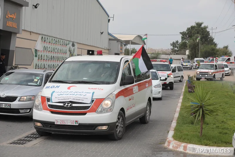 Palestinian ambulance drivers take part in a protest are called upon to pressure the Israeli to allow the free movement of patients through the Beit Hanoun checkpoint in front of the Erez Crossing in Beit Hanoun in the n...