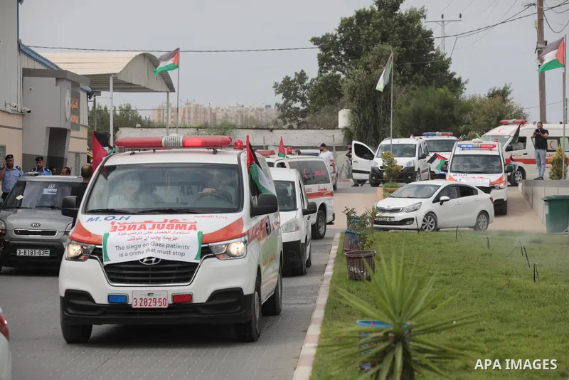Palestinian ambulance drivers take part in a protest are called upon to pressure the Israeli to allow the free movement of patients through the Beit Hanoun checkpoint in front of the Erez Crossing in Beit Hanoun in the n...