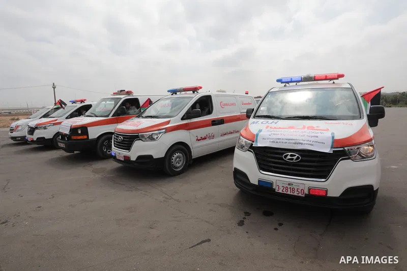 Palestinian ambulance drivers take part in a protest are called upon to pressure the Israeli to allow the free movement of patients through the Beit Hanoun checkpoint in front of the Erez Crossing in Beit Hanoun in the n...